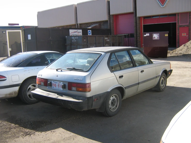 two cars parked on the side of a road