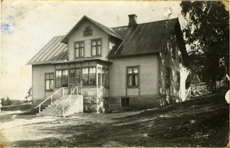 an old house with a black and white po of it