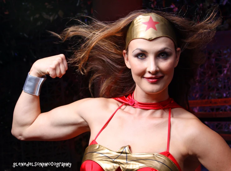 a young woman with a metal helmet poses for a po