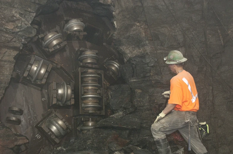 the man is going inside of the tunnel