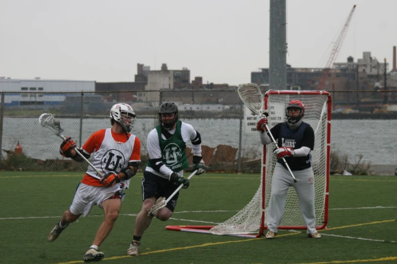 a lacrosse game being played with goalies and players