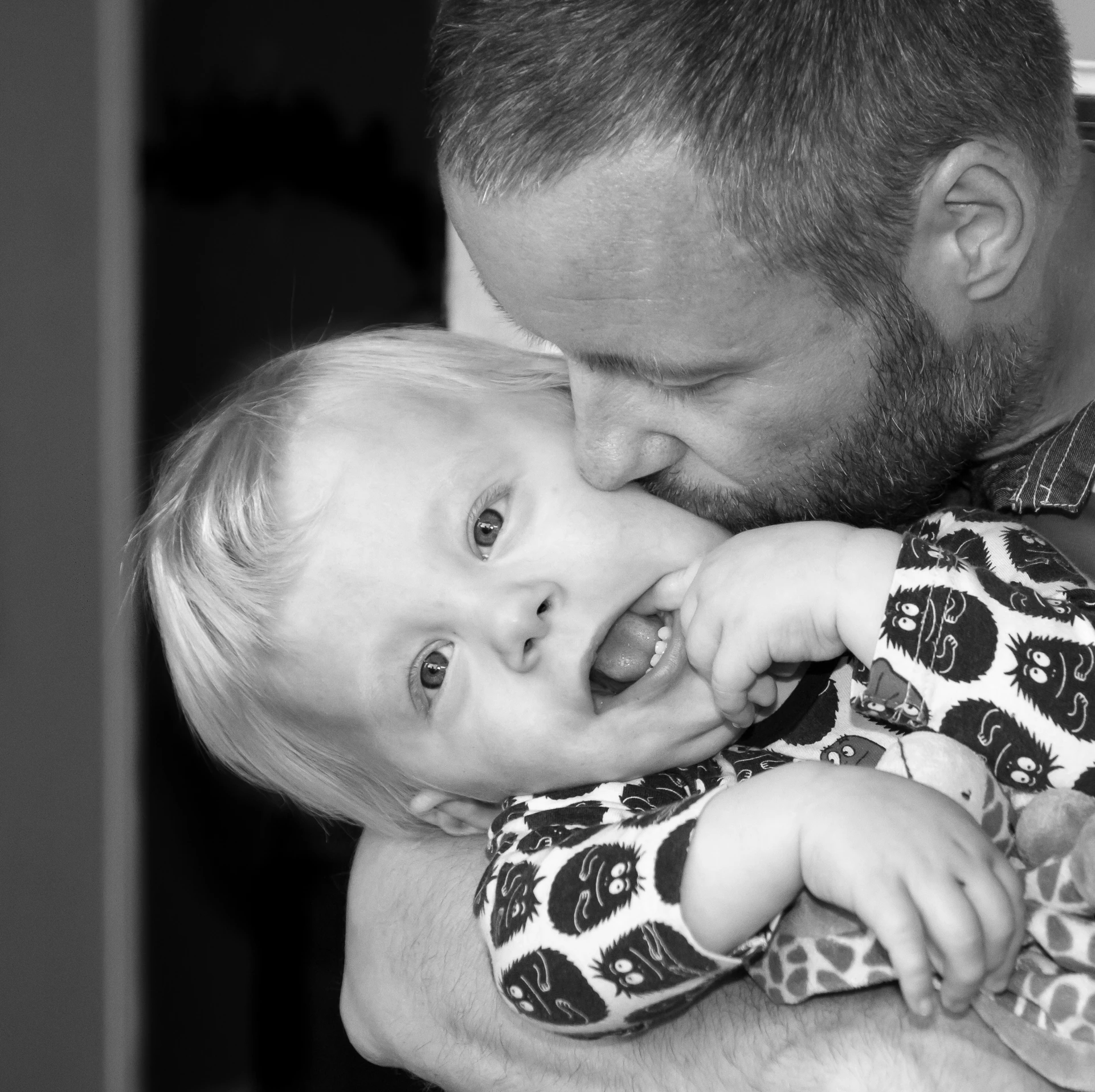 black and white po of a man with a child