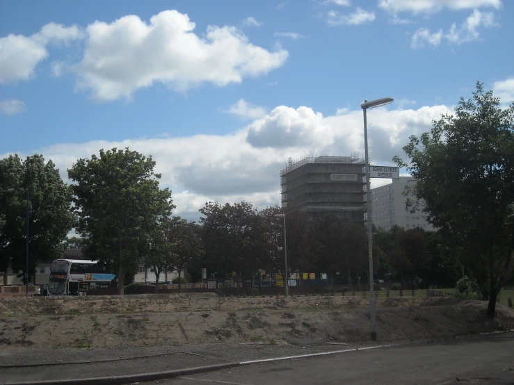 a building on the corner is near some trees