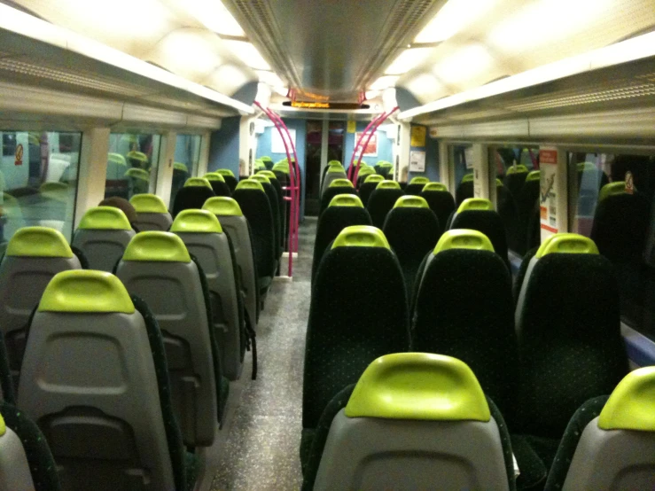 an empty bus is shown with many seats