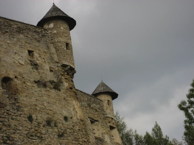 an old castle that is next to a tree