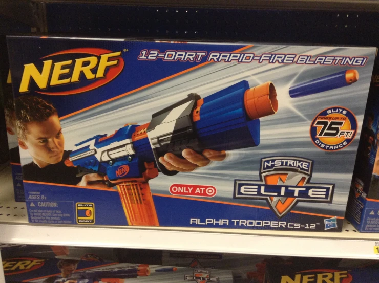 a boy is holding a nerf water gun