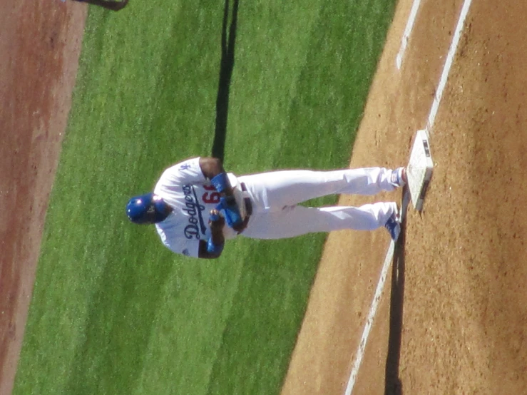 baseball player standing next to home plate in uniform