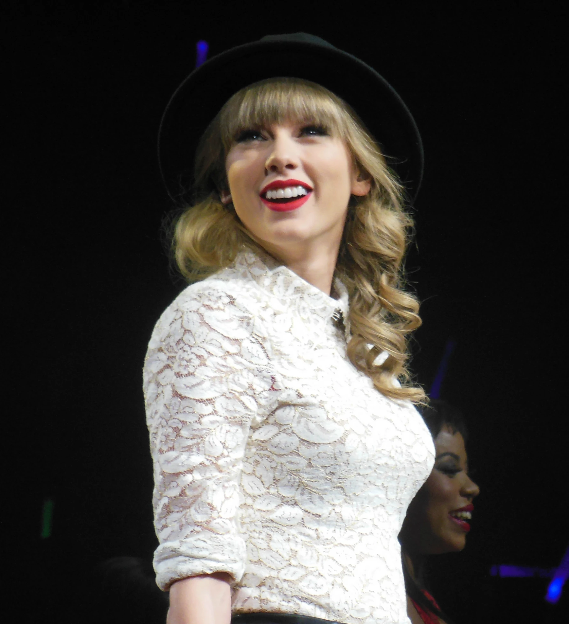 a close up of a person wearing a hat