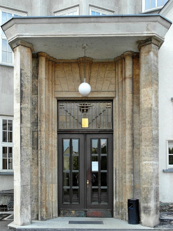 a large entrance with two doors and a white light