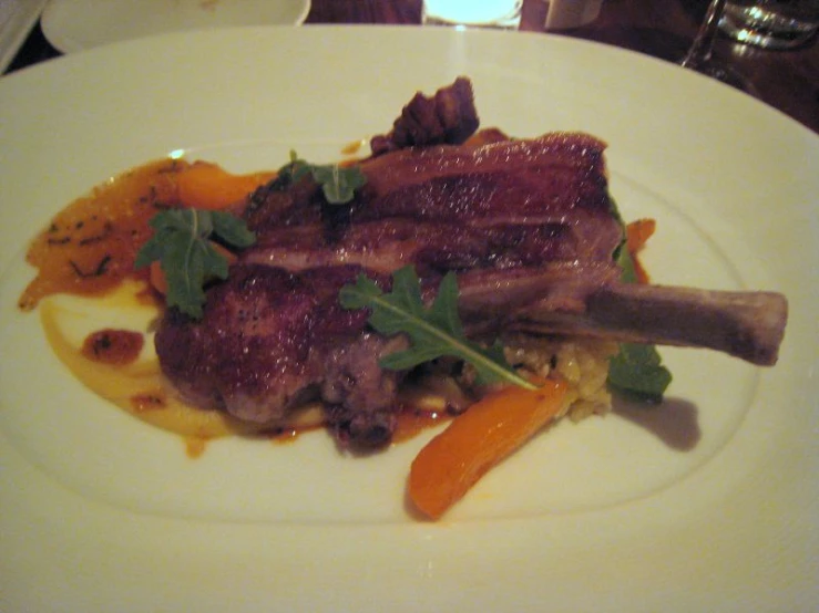 a plate of food on a table with a napkin and fork