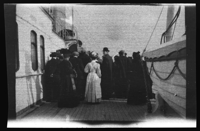 a group of people that are boarding a boat