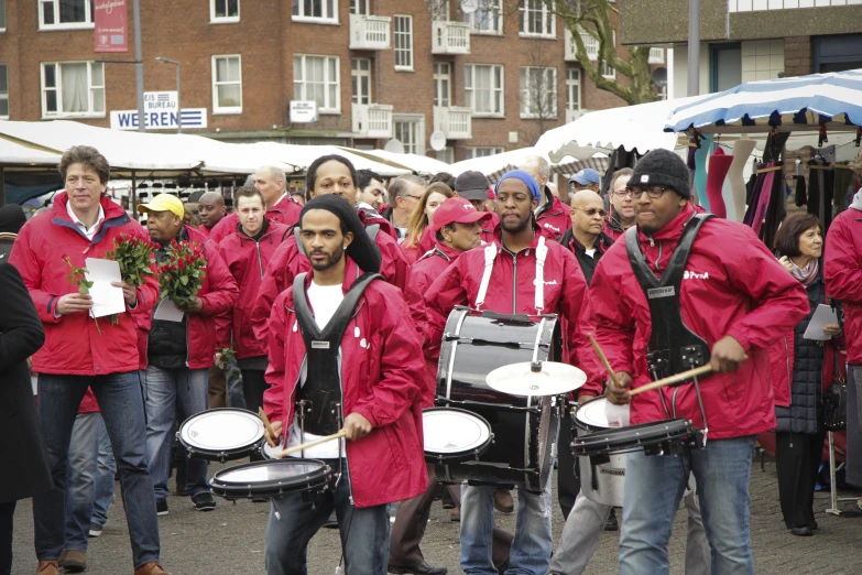 some people are in red and some with drums