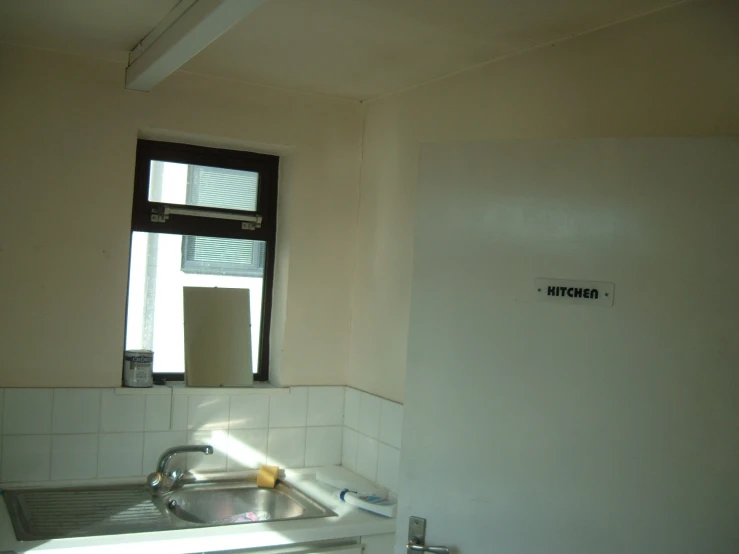 a view of a sink in a white bathroom