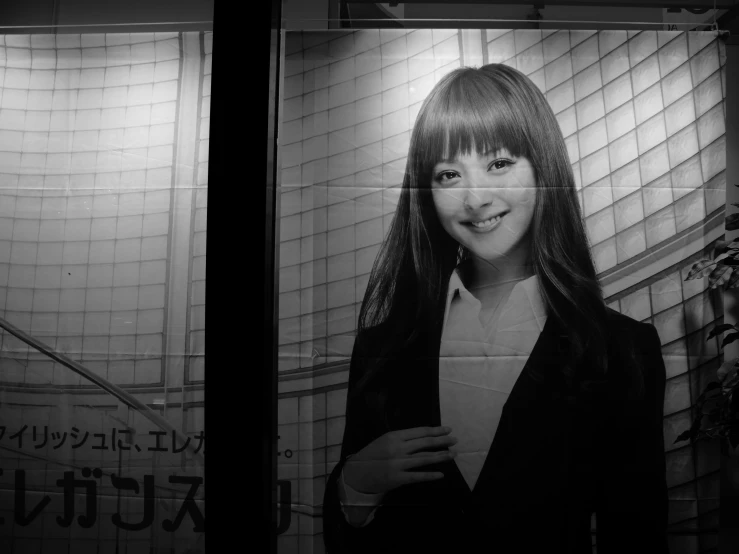 a picture of a woman with bangs on an elevator
