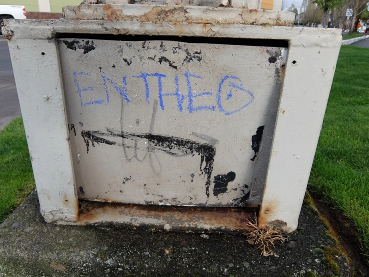 a graffiti written on the back of an old refrigerator