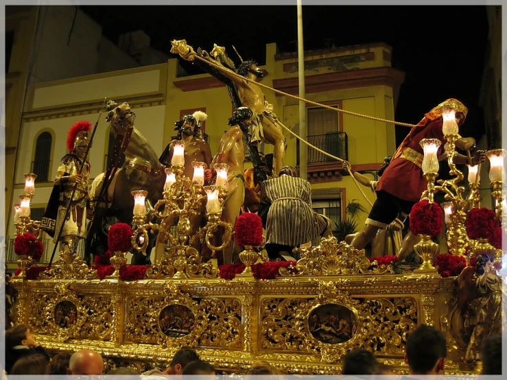 the elaborately decorated carriage is surrounded by candles and roses