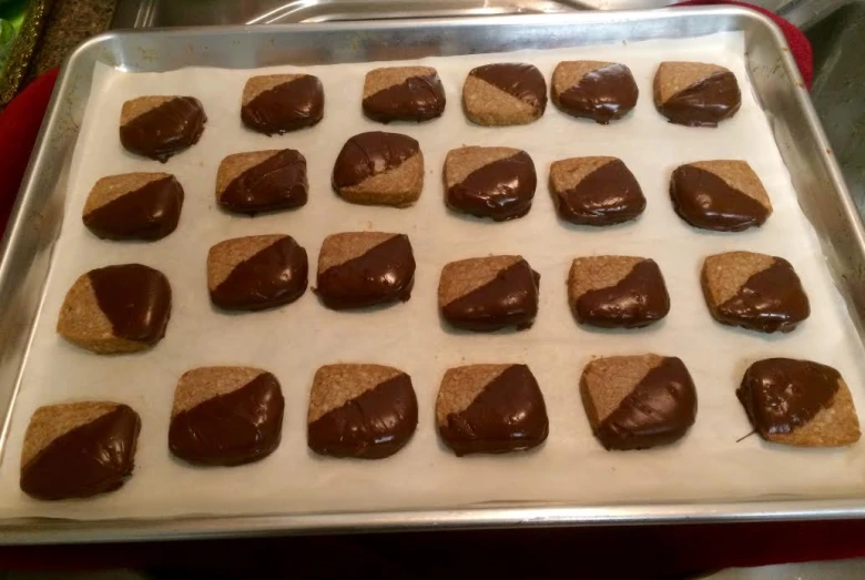 peanut er squares and cookies being prepared to be eaten