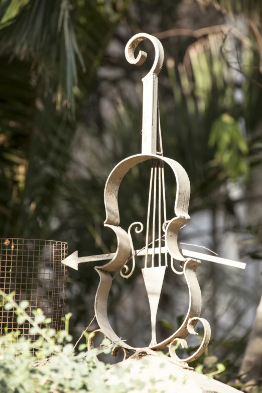 a piece of art that looks like a violin on a stand