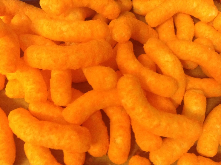 close up view of a bunch of carrots with oil