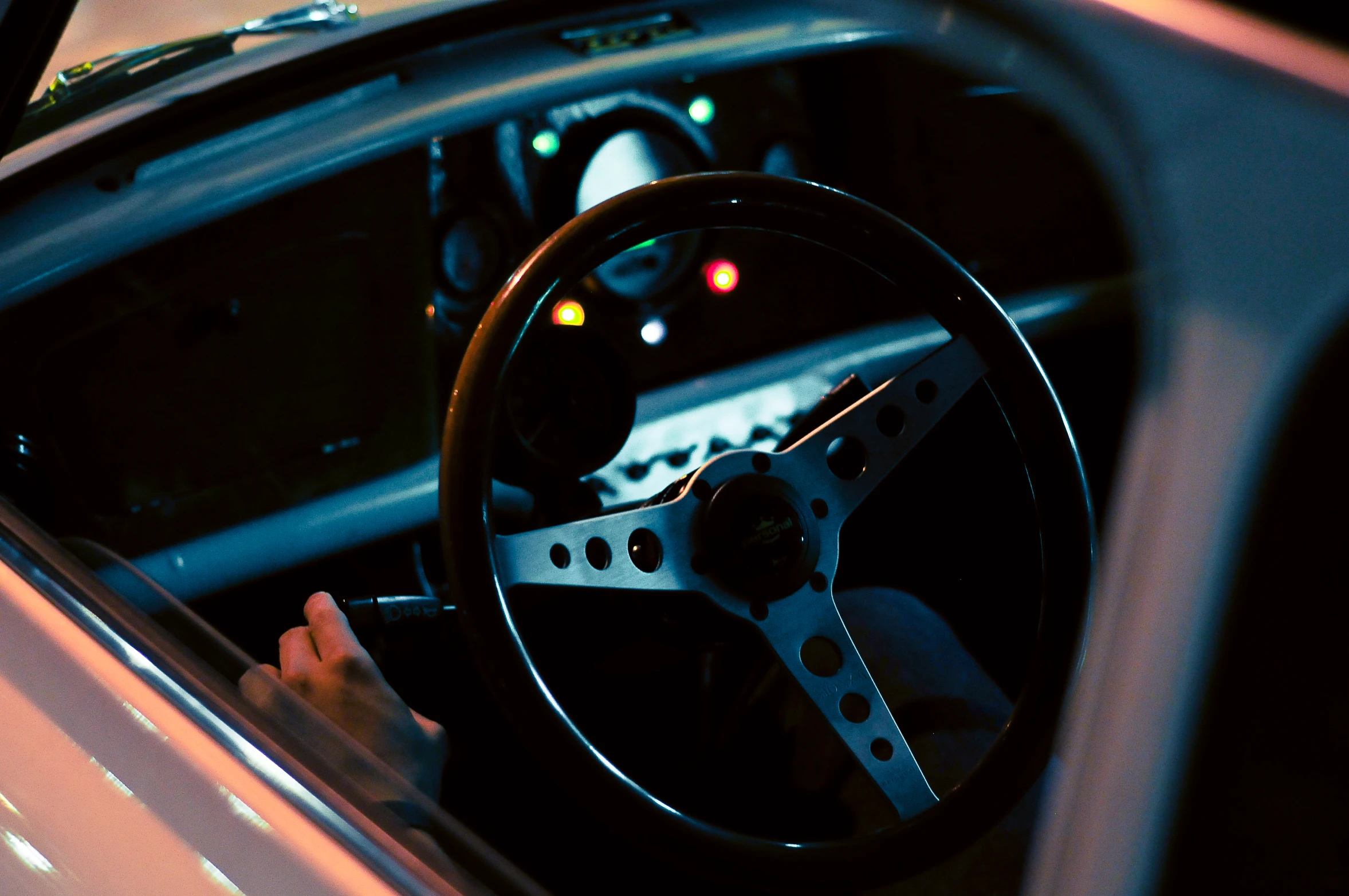 a driver with a steering wheel in his car