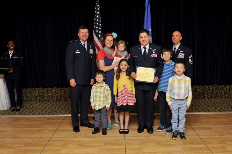 military families holding their awards and standing together