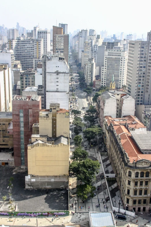 an aerial view of some tall buildings in the city