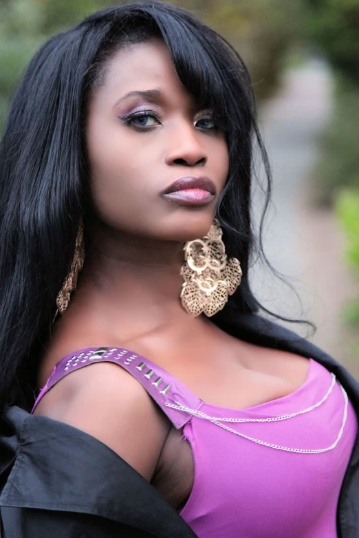 an african american woman wearing big earrings