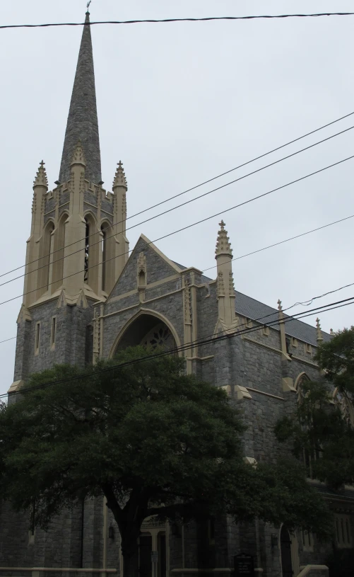 an older building has spires above its windows