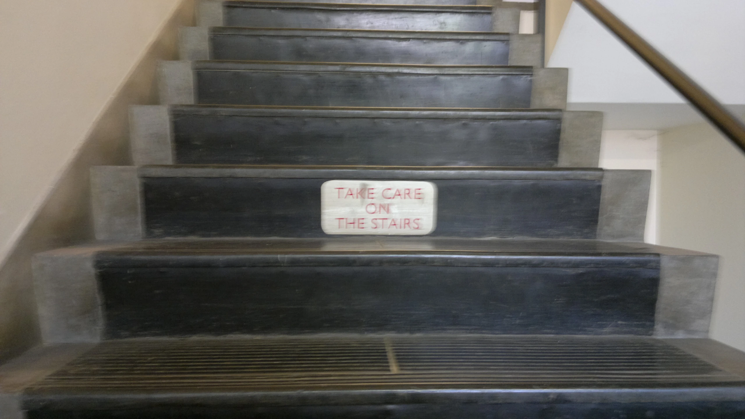 an old fashioned stair case with a sign that says'be safe to use the stairs '