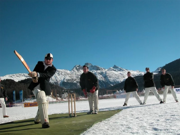 a group of people that are holding bats