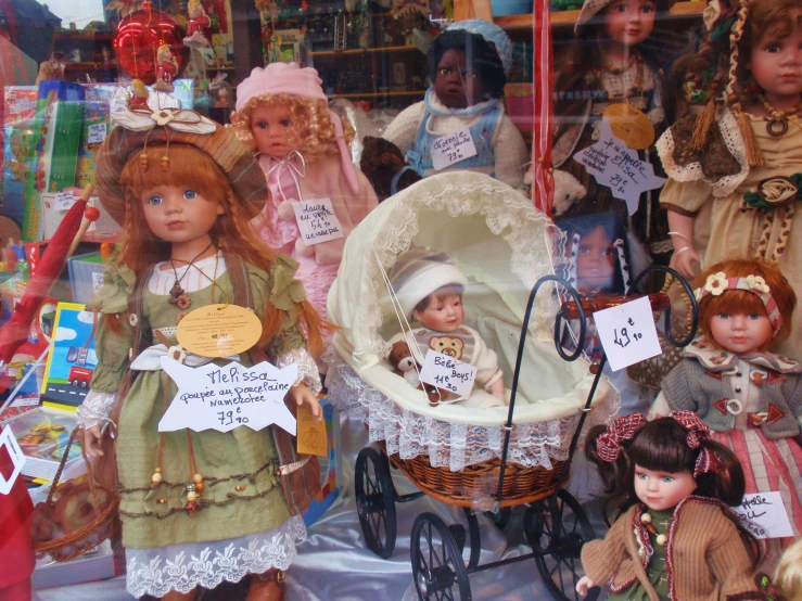 some dolls are dressed up in period clothes