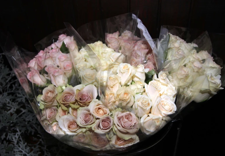 a large bouquet of flowers sitting in a glass vase
