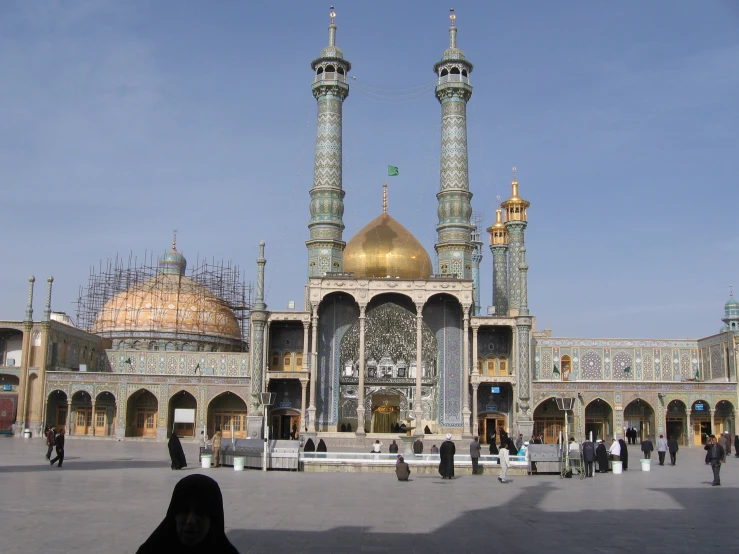 a very pretty building with large columns and gold domes