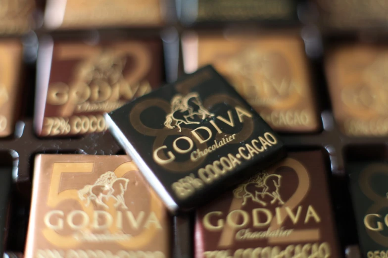 several chocolates with the names godiva on them