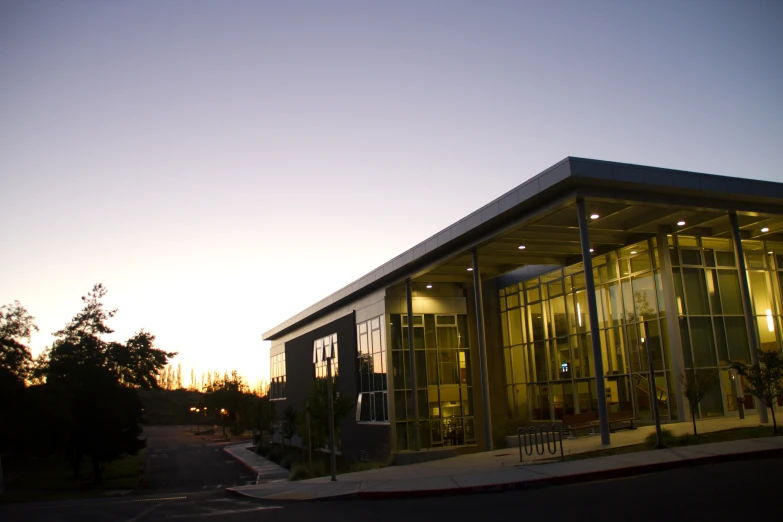 the entrance of a business center at night time