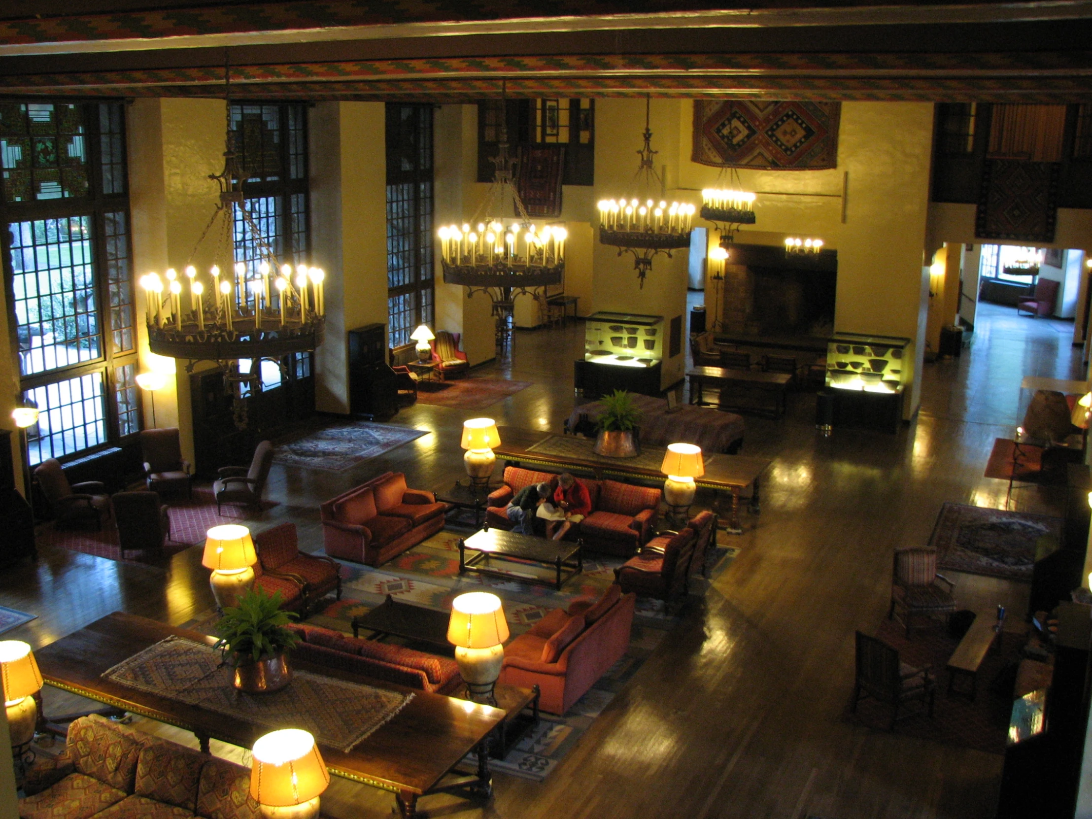 living room with several lights and tables and couches