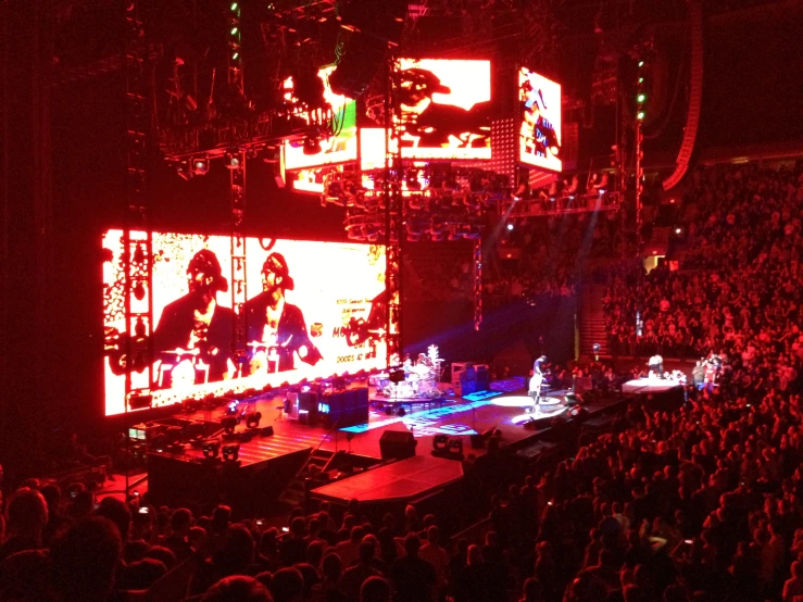 an audience watches on from the stage at the concert