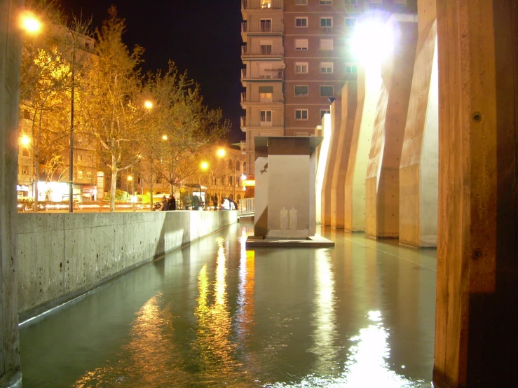 a view of a body of water and street lights