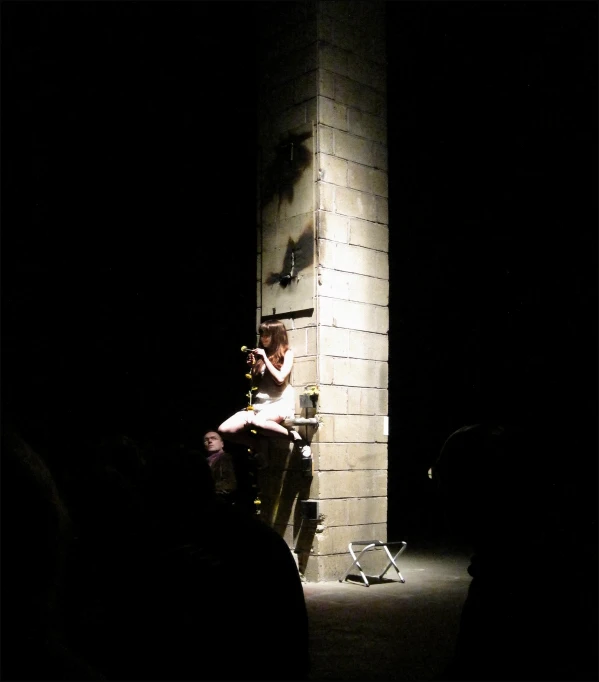 a boy with a violin and some music equipment