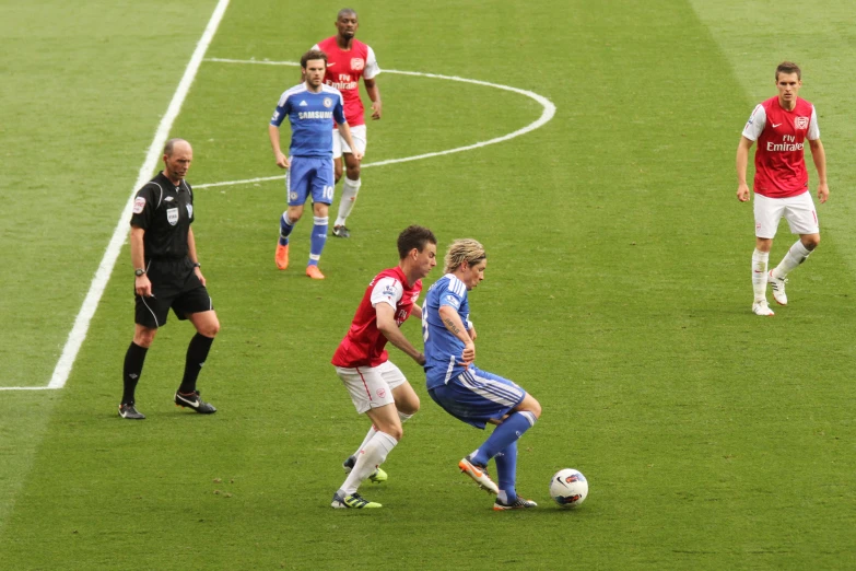 two soccer teams during a game on grass