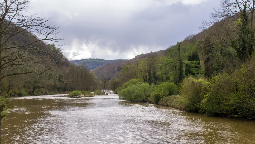 there are people riding boats down a river