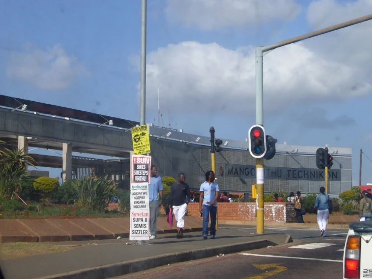 the street sign has been placed in front of the road