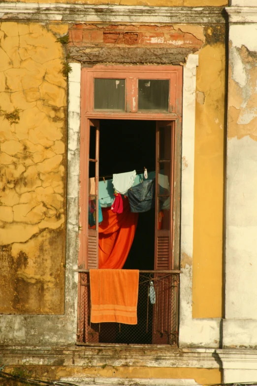 clothes are hung out to dry while drying in the window