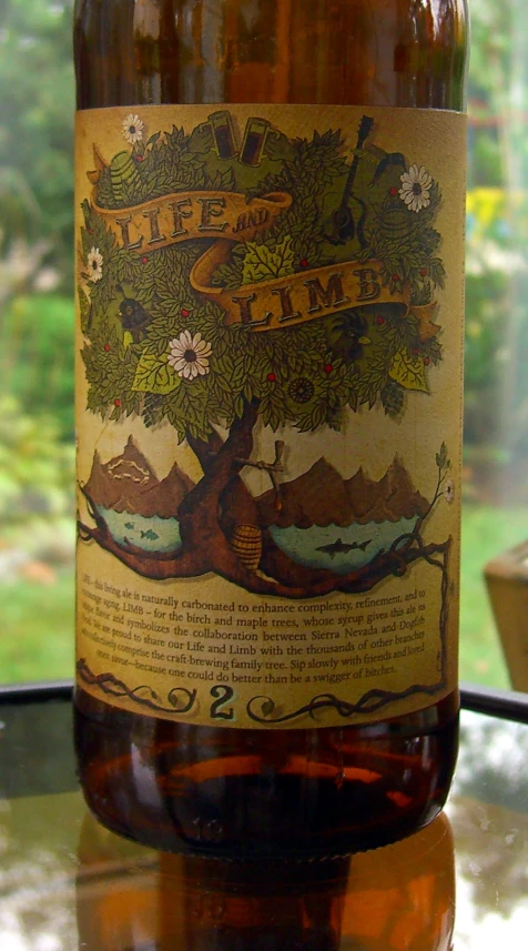 a glass bottle with a label that is decorated to the shape of a tree