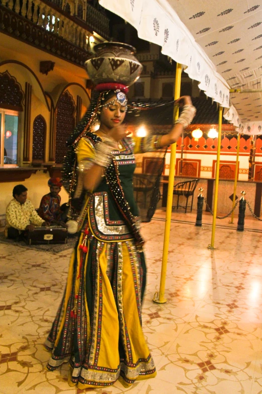 a dancer in traditional attire dancing at a festival