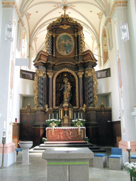 a large ornate church with a small alter