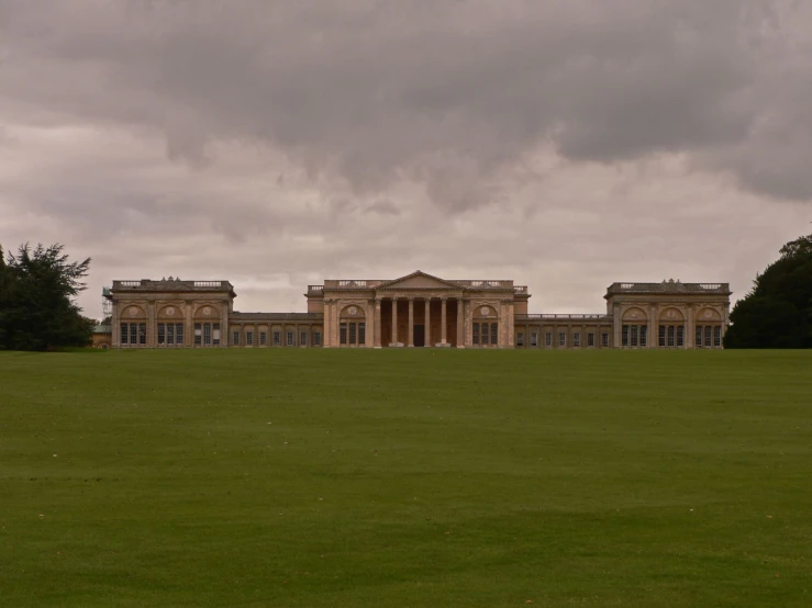 the large building has columns and pillars on the sides