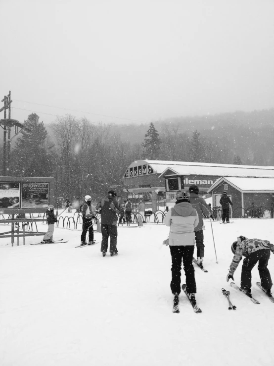 many people are skiing in the snow outside