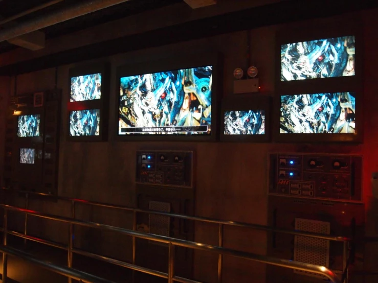 multiple screens are shown in the dark next to bars