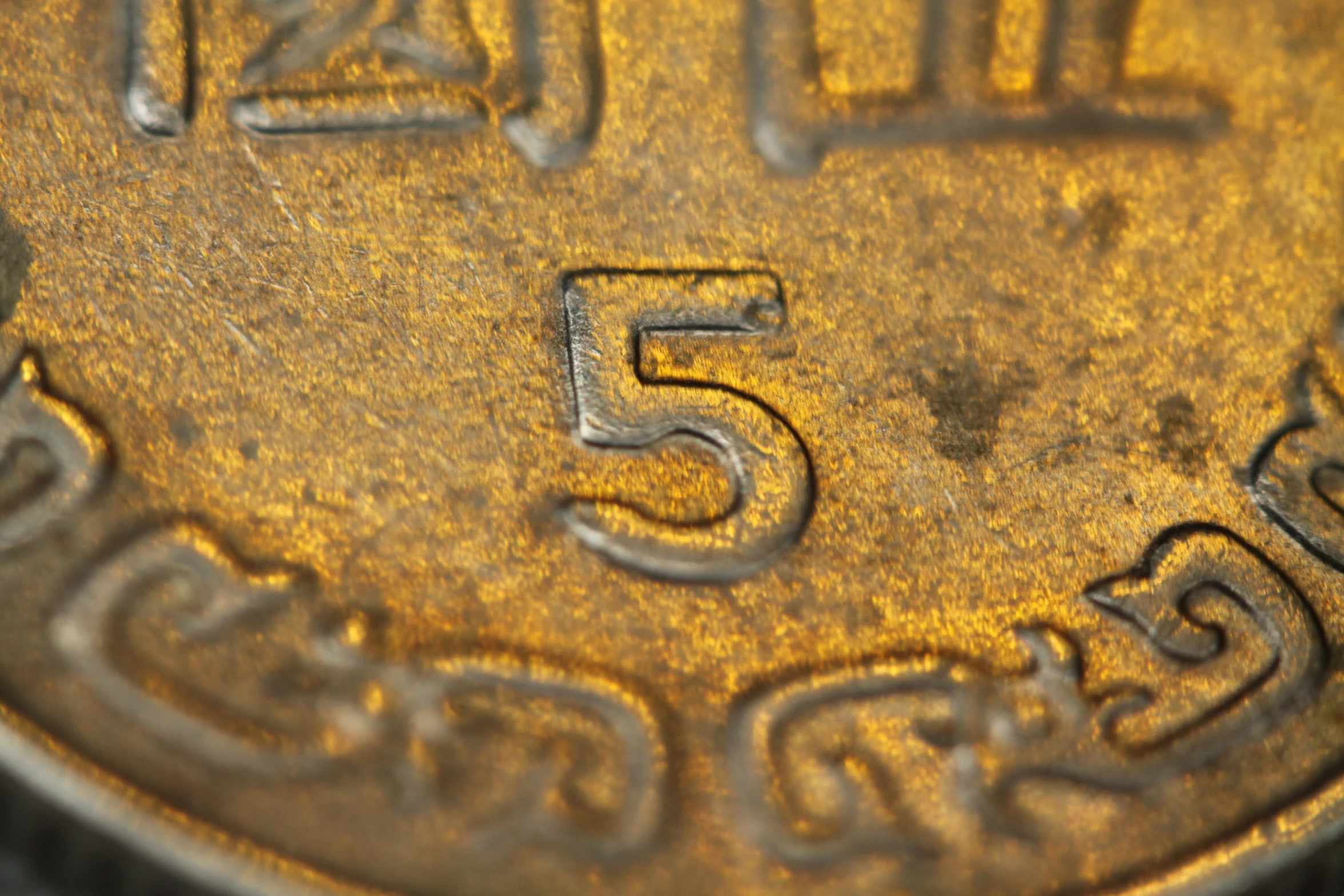 a close up image of a five cents coin